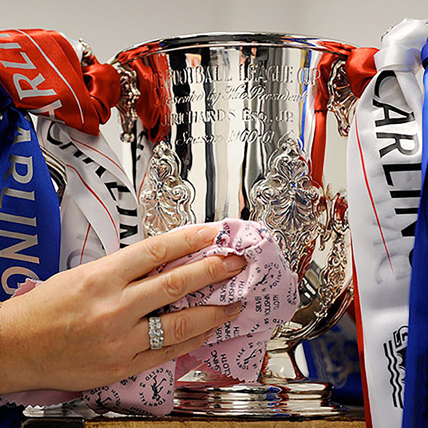 Football League Cup Trophy Being Polished with Town Talk Silver Polishing Cloth